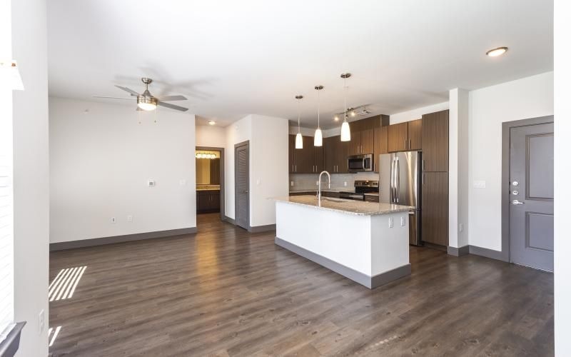 a kitchen with a wood floor