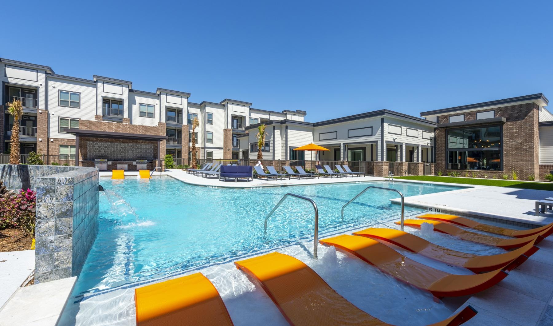 a swimming pool with a building in the background
